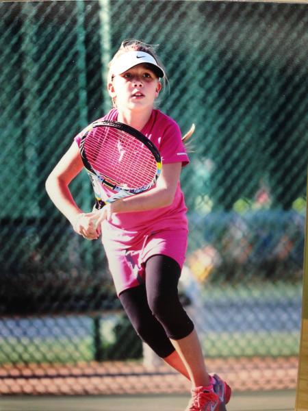 London Breedlove playing tennis