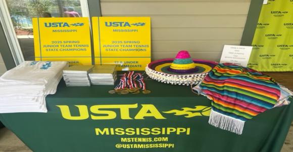 2025 JTT State Champs table with winners' medals, plaques, sombreros & ponchos